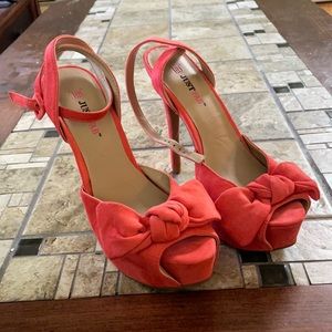 Coral colored suede bow heels